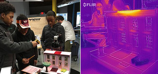 Students looking at a model home with a thermal IR camera